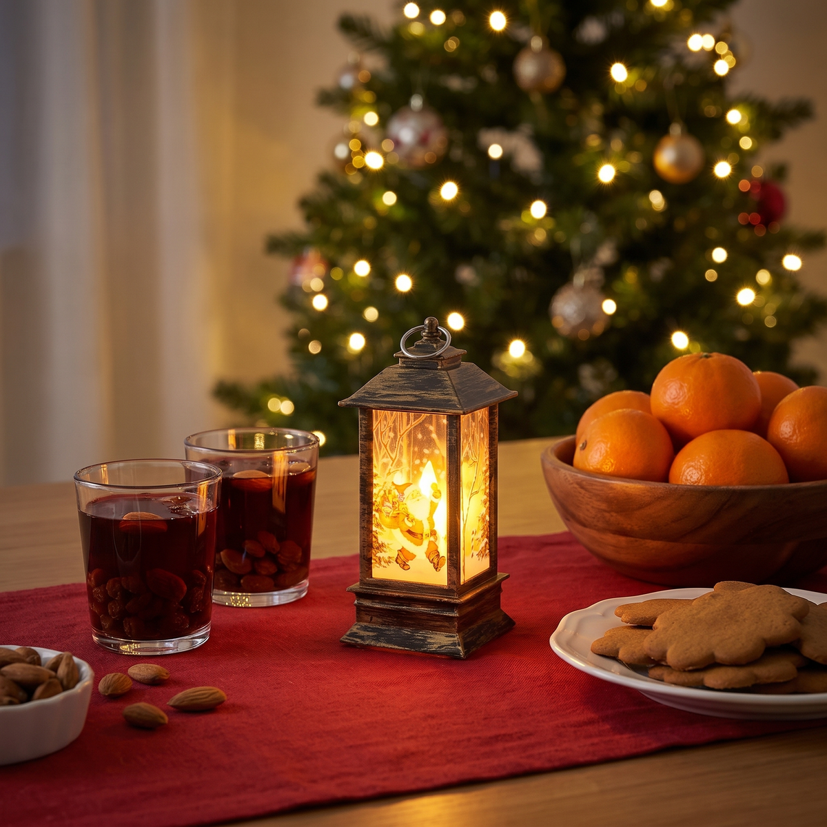 Fanal tänd på julbordet bredvid glögg och pepparkakor