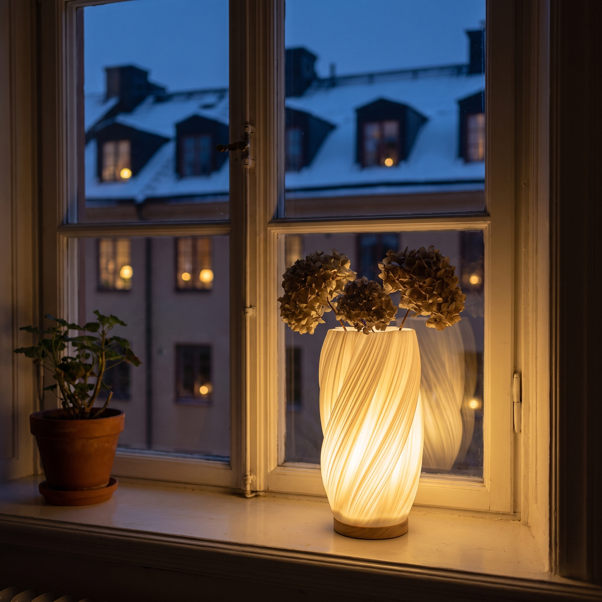 Sela tänd i fönstret en vinterkväll